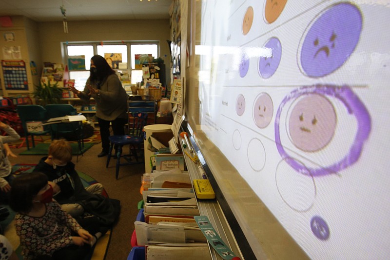 AP File Photo/Martha Irvine / Second-grade teacher Melissa Shugg teaches a lesson at Paw Paw Elementary School about thoughts, feelings and actions in December 2021 in Paw Paw, Mich.