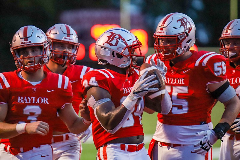 Staff photo by Olivia Ross / Baylor running back Caleb Hampton celebrates with his teammates after scoring a touchdown during a home win against Knoxville Catholic on Sept. 2. Hampton has averaged 9.2 yards per carry while helping the Red Raiders to a 4-0 start.