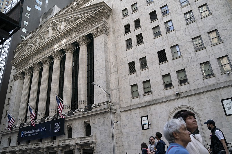 AP file photo / Pedestrians pass the New York Stock Exchange, May 5, 2022, in the Manhattan borough of New York.