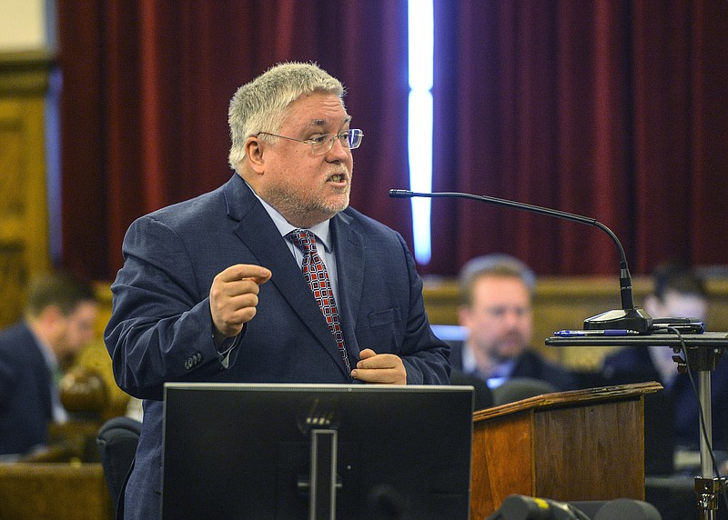 FILE - West Virginia Attorney General Patrick Morrisey presents opening arguments on April 4, 2022, the first day of the trial against opioid drug manufacturers, in Charleston, W.Va. A lawsuit filed by the state of West Virginia accusing several drug manufacturers of misrepresenting the risks of their painkilling drugs will go to trial in April 2023, Morrisey said Tuesday, Sept. 20, 2022. (Kenny Kemp/Charleston Gazette-Mail via AP, File)
