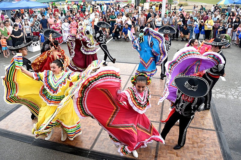 Staff Photo by Robin Rudd/  Dancers in traditional costume from Dalton, Ga., perform a folk dance from Mexico at the Chattanooga State Community College Latin Festival kicking off Hispanic Heritage Month on Sept. 14, 2019.