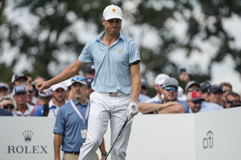 AP photo by Chris Carlson / U.S. team member Jordan Spieth reacts to his shot off the 14th tee at Quail Hollow Club during a foursomes match Thursday, the first day of the Presidents Cup in Charlotte, N.C.