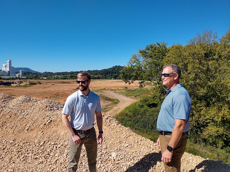 Staff photo by Mike Pare / Developers look over the sprawling 70-acre riverfront tract on Friday that's to hold a planned residential and commercial project at Amnicola Highway and Judd Road. From left are Jones Graham, project manager, and Scott Williamson, vice president at Fletcher Bright Co.