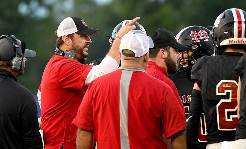 Staff file photo by Robin Rudd / Signal Mountain football coach Josh Roberts, left, and the Eagles were able to celebrate a homecoming victory Friday night against East Ridge.