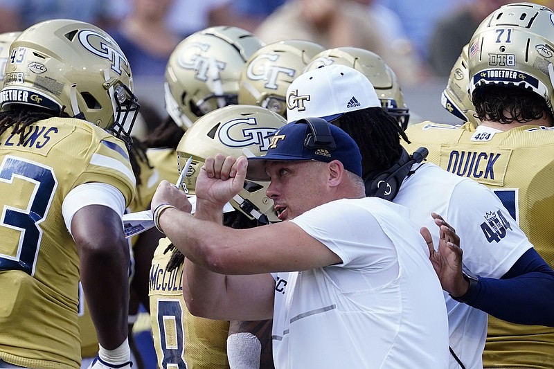 AP photo by John Bazemore / Georgia Tech football coach Geoff Collins speaks to defensive lineman Noah Collins, left, during the Yellow Jackets' 42-0 home loss to Ole Miss on Sept. 17.