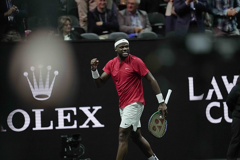 AP photo by Kin Cheung / Team World's Frances Tiafoe celebrates a point during his Laver Cup singles match against Team Europe's Stefanos Tsitsipas on Sunday at the O2 arena in London.