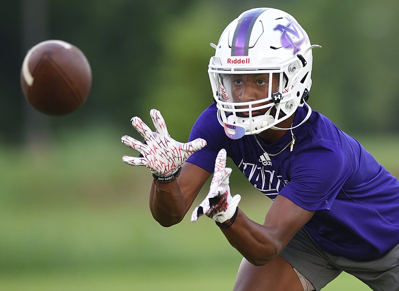 Staff photo by Matt Hamilton / Sam Pickett catches a pass during a practice at Marion County High School on Tuesday, July 19, 2022.