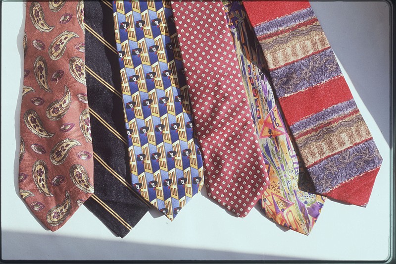 File Photo / Learning to tie a necktie is not only passed down from one generation to the next, but can be learned via YouTube without a family member's help.
