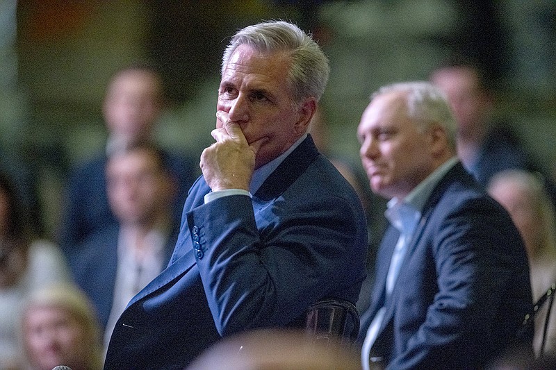 Photo by Pam Panchak / Pittsburgh Post-Gazette via The AP / U.S. Rep. Kevin McCarthy, foreground, and House Minority Whip Steve Scalise, background, listen to a question at the House GOP’s unveiling of their “Commitment to America” at a gathering at Ductmate Industries on Friday, Sep. 23, 2022, in Monongahela, Pa.