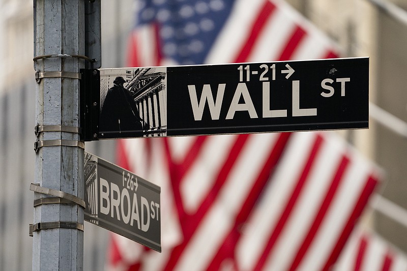 FILE - Street signs at the intersection of Wall and Broad Streets are shown in lower Manhattan, Wednesday, Oct. 13, 2021.   (AP Photo/John Minchillo, File)