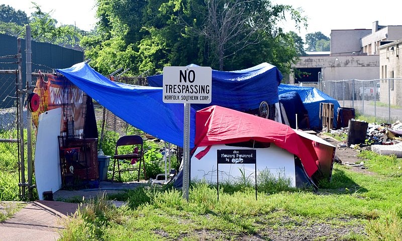 Staff Photo by Robin Rudd / A homeless encampment is seen on Norfolk Southern Railway property on Baldwin Street between 10th and 11th Street on June 2, 2022.