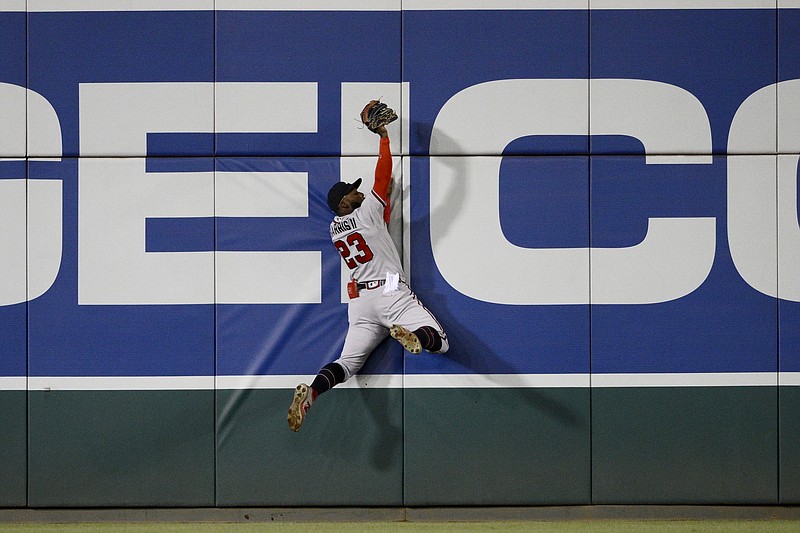 AP photo by Nick Wass / Atlanta Braves center fielder Michael Harris II makes the catch on a fly ball hit by the Washington Nationals' Joey Meneses during the third inning of Wednesday night's game in Washington.