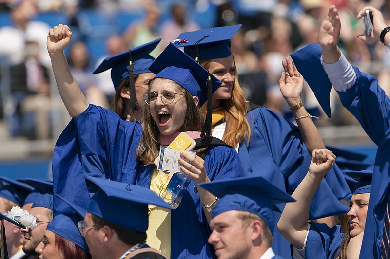 AP File Photo/Manuel Balce Ceneta / Graduates celebrate during the University of Delaware Class of 2022 commencement ceremony in Newark, Del., in May, and they may celebrate again if they have income-driven repayment plans on their student loans.