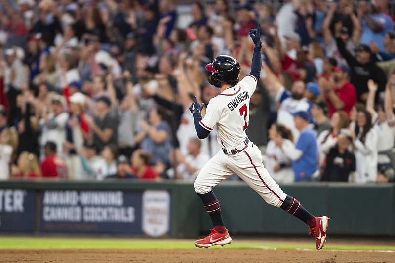 AP photo by Hakim Wright Sr. / Atlanta Braves shortstop Dansby Swanson celebrates after hitting a solo home run in the first inning of Sunday night's home game against the New York Mets.