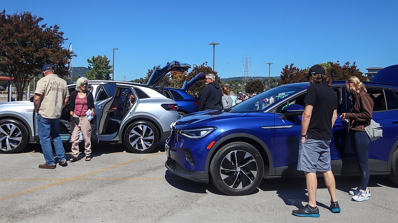 Staff photo by Olivia Ross  / Cars are lined up for viewing. For National Drive Electric Week, many gathered at The Bend for the 2022 Chattanooga Drive Electric Festival on Saturday, October 1, 2022.