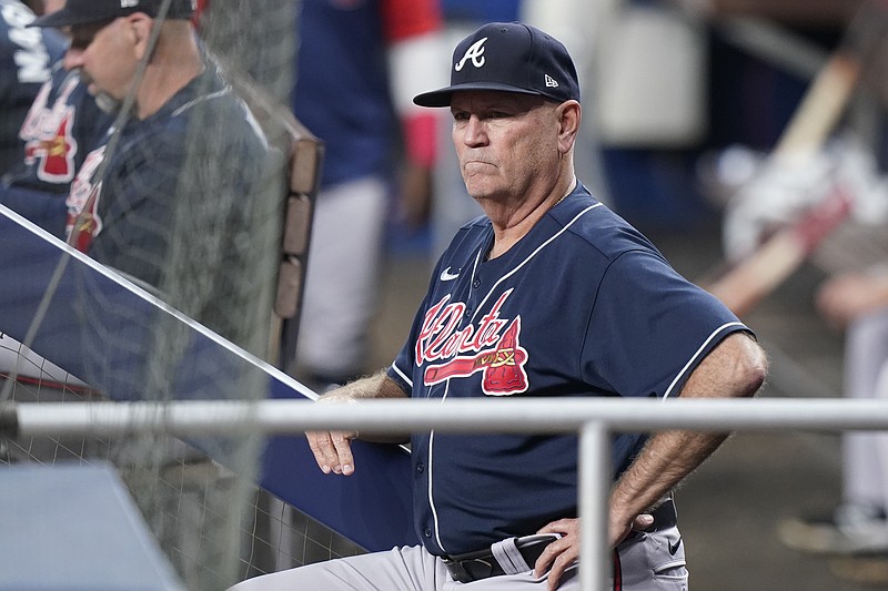 Atlanta Braves manager Brian Snitker looks on during the fourth inning of a baseball game against the Miami Marlins, Monday, Oct. 3, 2022, in Miami. (AP Photo/Wilfredo Lee)