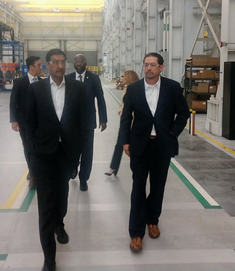 Staff photo by Mike Pare / U.S. Rep. Ro Khanna, D-Santa Clara, California, left, tours the Chattanooga Novonix plant with Daniel Deas, president of the company's anode materials division, on Monday. Khanna was in the city at the invitation of Chattanooga Mayor Tim Kelly.