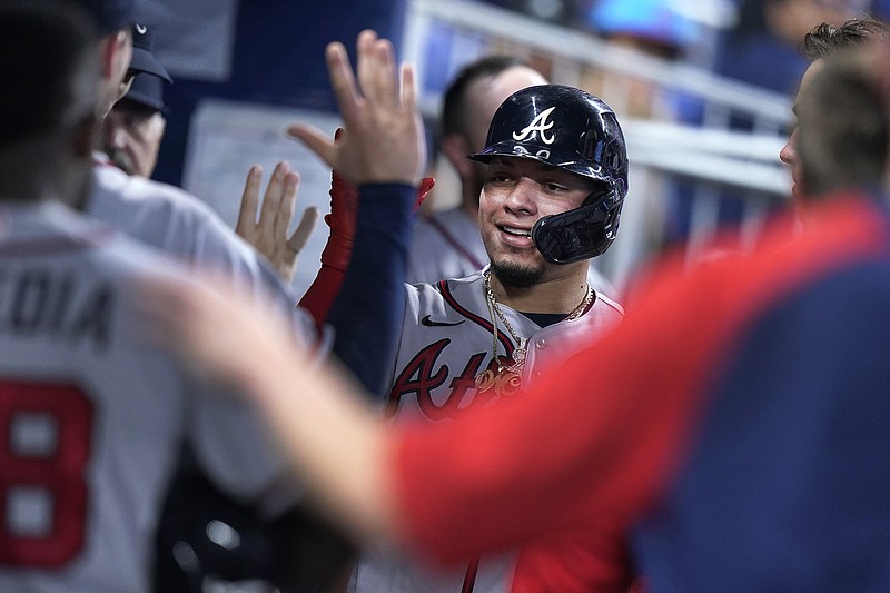 AP photo by Wilfredo Lee / Atlanta Braves catcher William Contreras is congratulated by teammates after he scored on a single by Eddie Rosario during the fourth inning of Wednesday's loss to the host Miami Marlins.