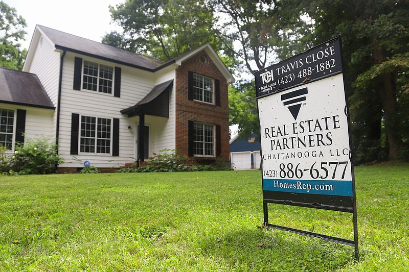 Staff photo by Olivia Ross / A For Sale sign sits in a Signal Mountain home's lawn on August 15, 2022.