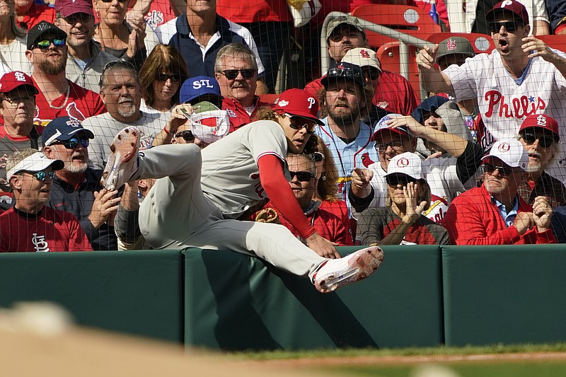 AP photo by Jeff Roberson / Philadelphia Phillies third baseman Alec Bohm makes a catch on a ball hit by the St. Louis Cardinals' Lars Nootbaar during the third inning of Friday's NL wild-card matchup in St. Louis.