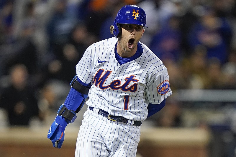 AP photo by John Minchillo / The New York Mets' Jeff McNeil celebrates after hitting a two-run double in the seventh inning of Saturday night's home playoff game against the San Diego Padres.