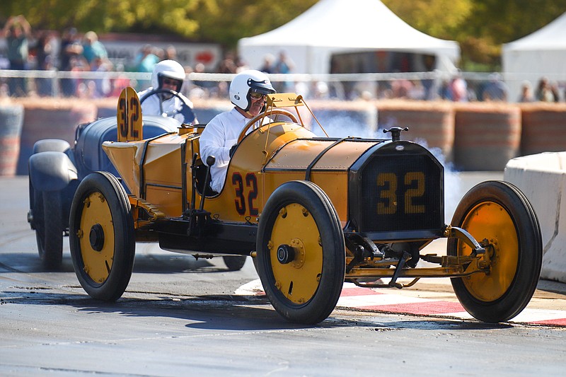 Staff photo by Olivia Ross  / Kindall Jolly races around the track. Brass and tin top vehicles from 1908-1918 participate in a feature race at the Chattanooga Motorcar Festival on Saturday, October 15, 2022 at The Bend.