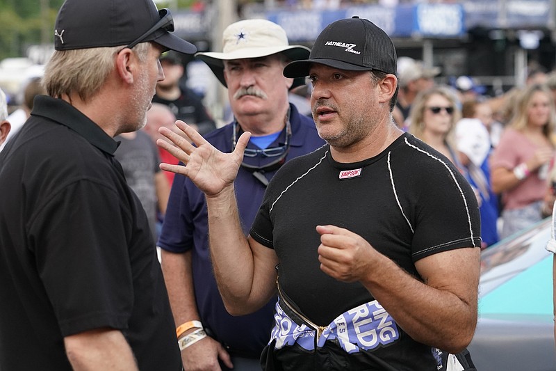 AP photo by Mark Humphrey / Stewart-Haas Racing co-owner Tony Stewart, right, said Wednesday that he's "so mad at NASCAR right now," he wouldn't talk about the sanctioning body's latest penalties levied at SHR.