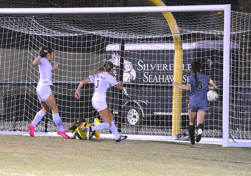 Staff photo by Patrick MacCoon / Boyd Buchanan's Kate Wood, far left, watches her winning goal go into the net during the 58th minute of Thursday's 2-1 victory at Silverdale Baptist Academy in the Division II-A East Region championship match.