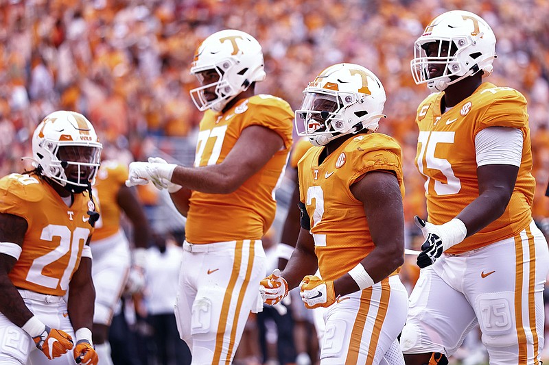 AP photo by Wade Payne / Tennessee running back Jabari Small (2) celebrates with teammates after scoring a touchdown during the first half of Saturday's home win against Alabama.