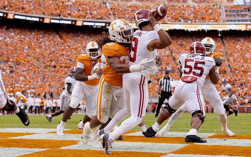 Tennessee Athletics photo by Andrew Ferguson / Tennessee linebacker James Banks slams into Alabama quarterback Bryce Young during the first half of Saturday’s 52-49 win by the Volunteers.