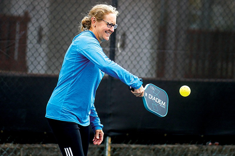 Staff photo by Olivia Ross  / Physical Therapist Andrea Abercrombie plays pickelball at the Red Bank City Park courts.