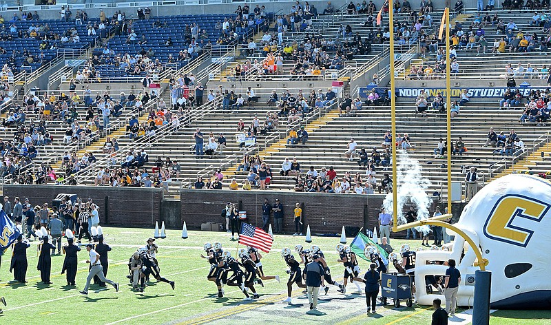 Staff Photo by Robin Rudd / The University of Tennessee at Chattanooga football team takes the field before last Saturday’s 41-13 throttling of VMI, a game that took place before a season-low crowd of 6,284 at FInley Stadium.