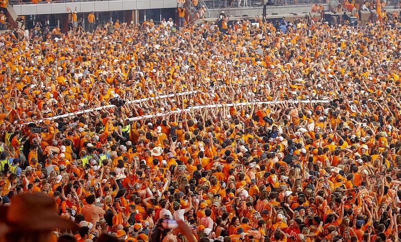 Tennessee Athletics photo by Emma Ramsey / Tennessee football fans take down the goal posts at Neyland Stadium following last Saturday’s 52-49 win over Alabama.