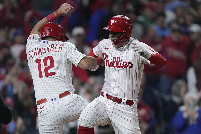 AP photo by Matt Rourke / The Philadelphia Phillies' Rhys Hoskins, after hitting a two-run homer, celebrates with Kyle Schwarber during the fifth inning of Game 4 of the NLCS against the visiting San Diego Padres on Saturday.