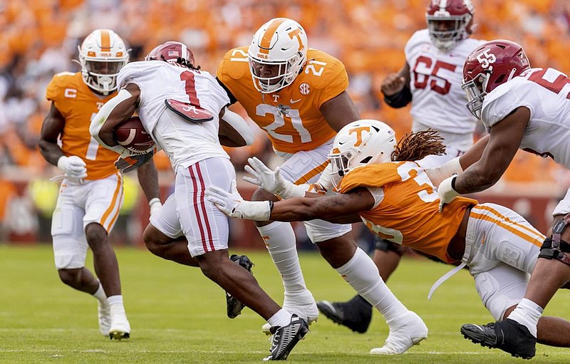 Tennessee Athletics photo by Andrew Ferguson / Tennessee safety Trevon Flowers, left, defensive tackle Omari Thomas (21) and linebacker James Banks close in on Alabama running back Jahmyr Gibbs during the Vols' 52-49 win on Oct. 15.