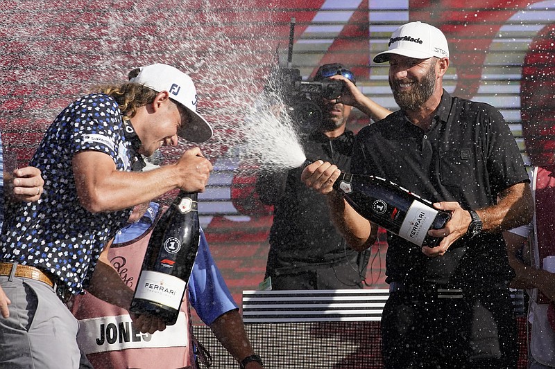 AP photo by Lynne Sladky / Cameron Smith, left, and Dustin Johnson, right, celebrate after the final round of the LIV Golf team championship event Sunday at Trump National Doral Miami Golf Club in Florida.