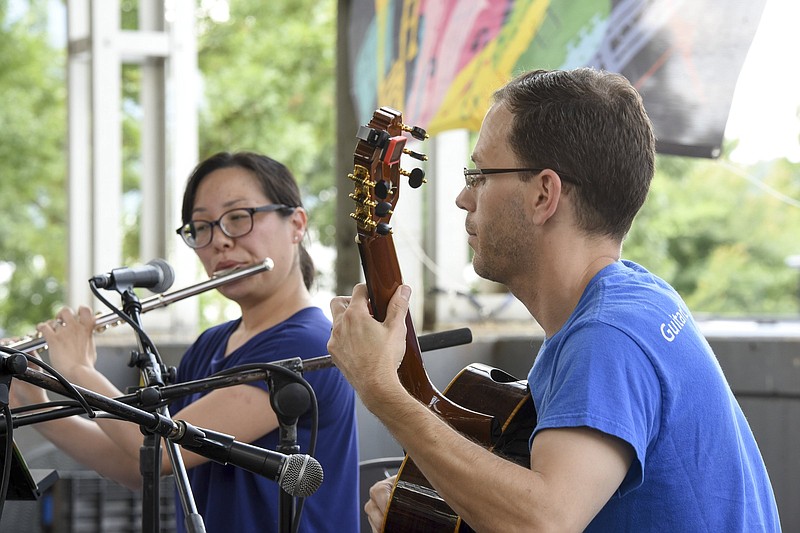 Staff file photo  / Flautist Kayoko Dan, left, joins classical guitarist Michael McCallie for a performance at Chattanooga Market.