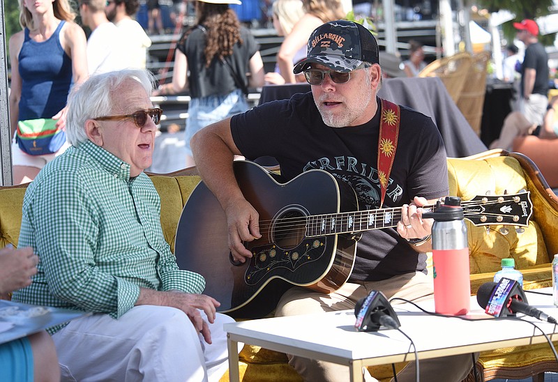 Staff photo by Matt Hamilton / Festival host Leslie Jordan, left, sings along with musician Danny Myrick in the VIP area during the second day of the Riverbend Festival on June 4.
