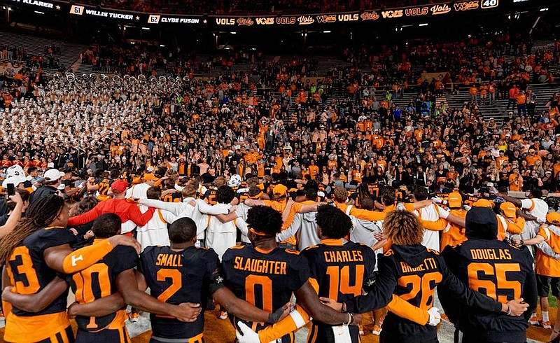Tennessee Athletics photo / Tennessee football players sing the university’s alma mater with students and the Pride of the Southland marching band after last Saturday night’s 44-6 dismantling of Kentucky inside Neyland Stadium.