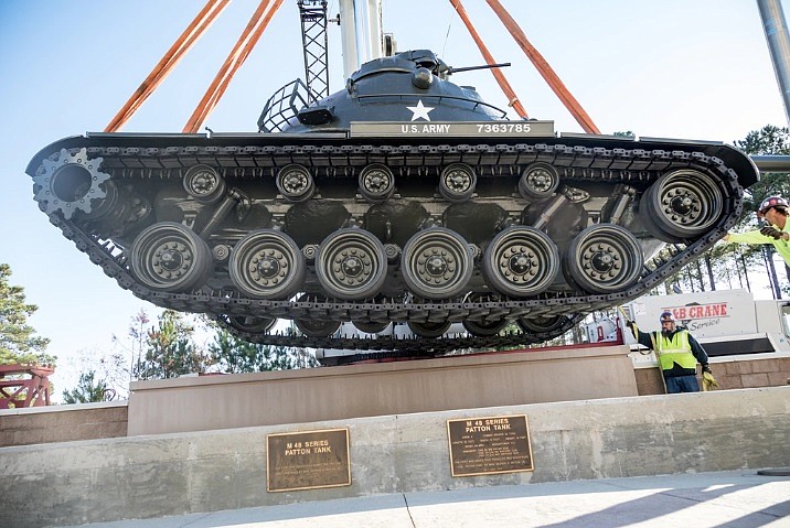 U.S. Army Photo by Staff Sgt. Anri Baril / Crane operations contractors in 2019 carry out a heavy lift and rig operation on an M48 Patton tank in front of Patton Hall at Shaw Air Force Base in Sumter, S.C. Soddy-Daisy is obtaining a similar tank for public display.