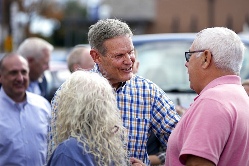 Tennessee Gov. Bill Lee greets people as he campaigns Thursday, Nov. 3, 2022, in Crossville, Tenn. (AP Photo/Mark Humphrey)