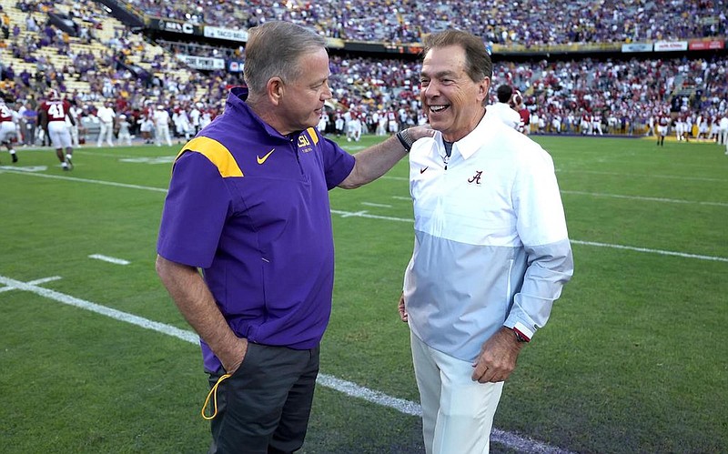 Crimson Tide photos / LSU first-year football coach Brian Kelly and Alabama’s Nick Saban visit prior to last Saturday night’s 32-31 win in overtime by the Tigers.