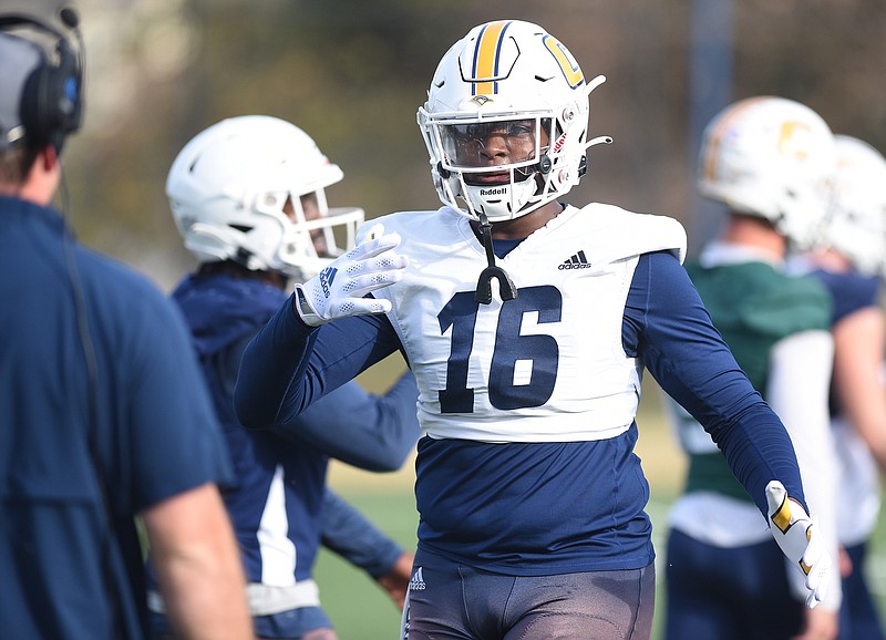 Staff photo by Matt Hamilton / UTC freshman tight end Camden Overton talks to a coach between plays during practice Thursday at Scrappy Moore Field.