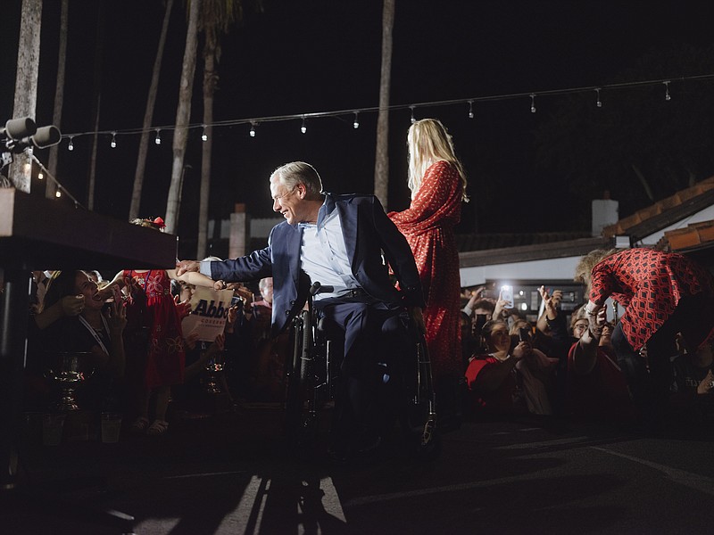 Photo by Christopher Lee/The New York Times / Texas Republican Gov. Greg Abbott greets supporters after he was declared the winner at a watch party in McAllen, Texas, on Nov. 8, 2022.