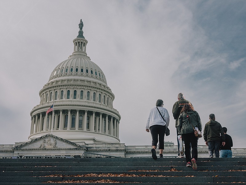 Photo by Christopher Lee/The New York Times / People walk near the Capitol building in Washington, on Nov. 2, 2022. A convulsion has shaken America and many western Democracies over the past few years, writes New York Times columnist David Brooks.