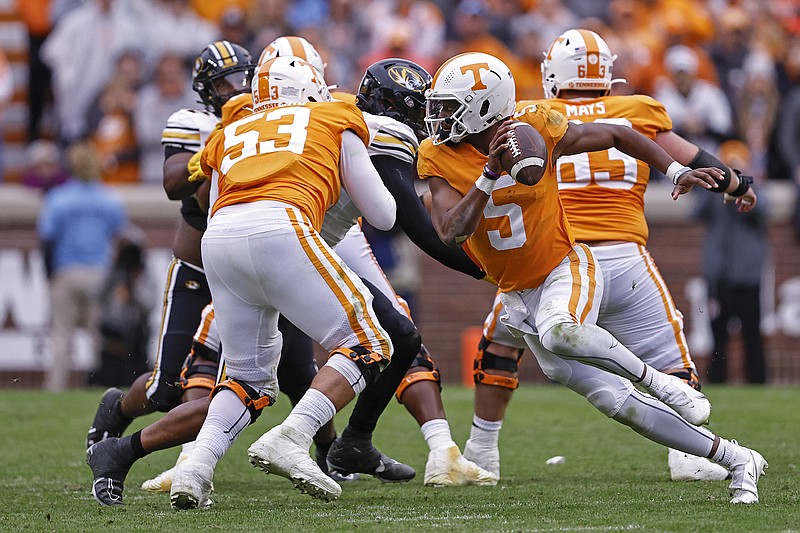 AP photo by Wade Payne / Tennessee quarterback and Heisman Trophy hopeful Hendon Hooker (5) passed for 355 yards and rushed for 50 to help the Vols compile 724 in a 66-24 rout of Missouri on Saturday at Neyland Stadium.