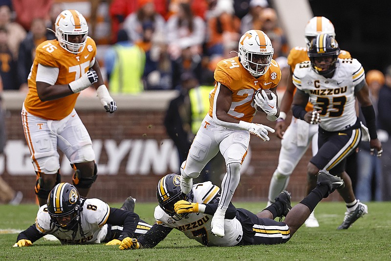 AP photo by Wade Payne / Tennessee freshman running back Dylan Sampson escapes Missouri defensive lineman DJ Coleman's tackle attempt Saturday in Knoxville. Sampson rushed eight times for 98 yards and a touchdown during the Vols' 66-24 rout of Missouri despite playing just the third and fourth quarters.