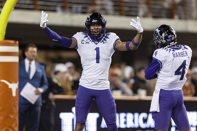 TCU wide receiver Quentin Johnston (1) celebrates a touchdown against Texas with wide receiver Taye Barber (4) during the second half of an NCAA college football game Saturday, Nov. 12, 2022, in Austin, Texas. (AP Photo/Stephen Spillman)