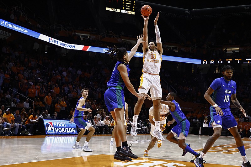 AP photo by Wade Payne / Tennessee forward Olivier Nkamhoua shoots over Florida Gulf Coast center Andre Weir during the Vols' 81-50 win Wednesday night at Thompson-Boling Arena.