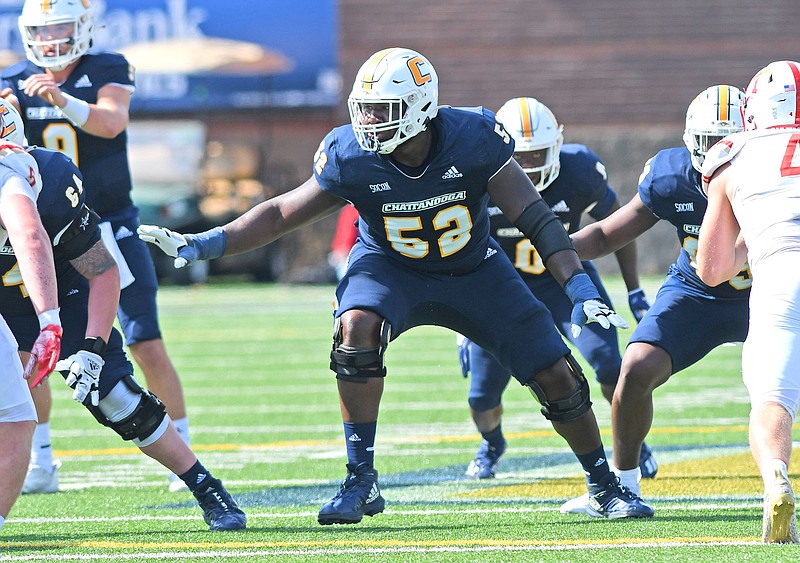 Staff photo by Robin Rudd / UTC offensive lineman McClendon Curtis (52) moves to block during a SoCon game against Virginia Military Institute on Oct. 15 at Finley Stadium.